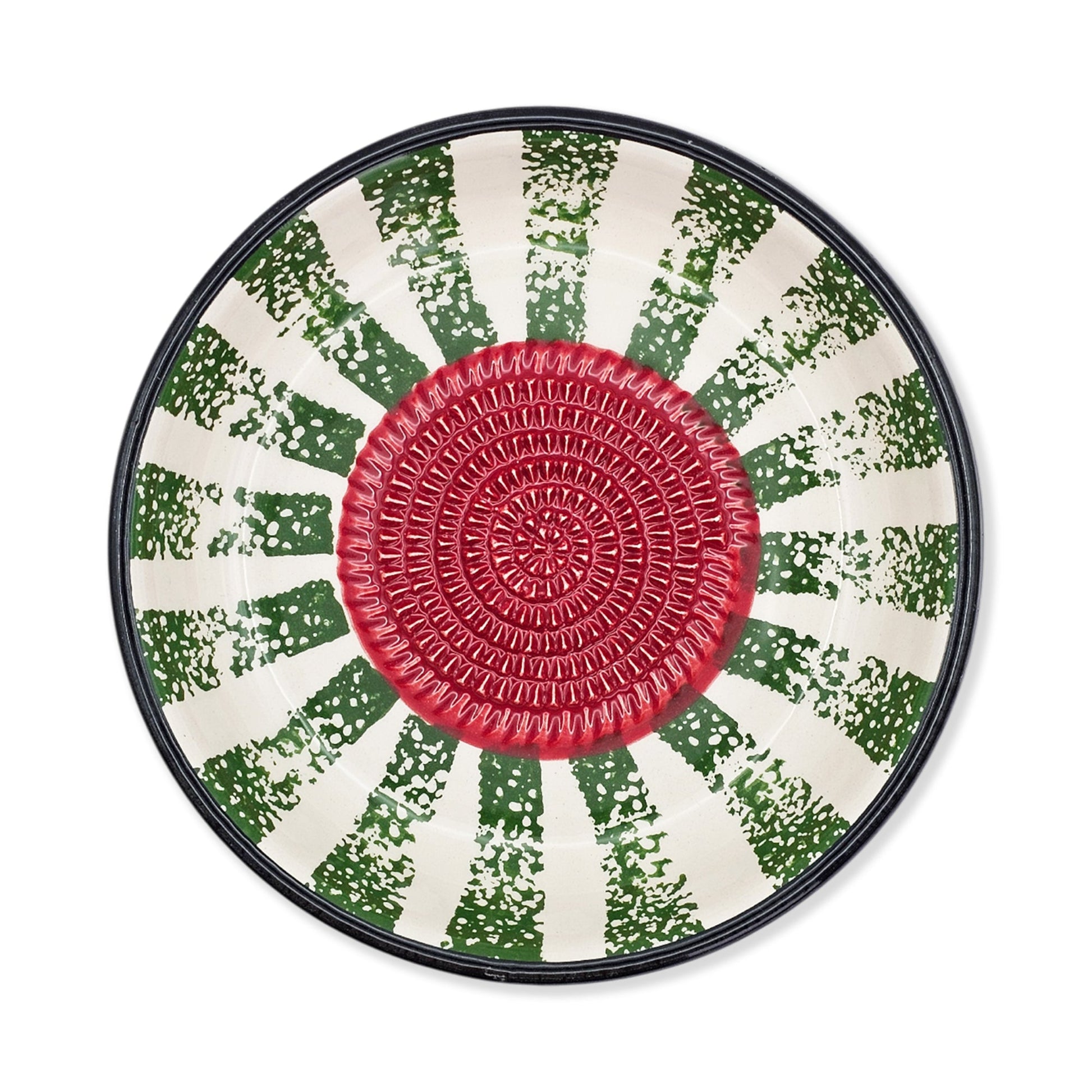 Round garlic grater bowl with a red center and green and white patterned rim on a white background