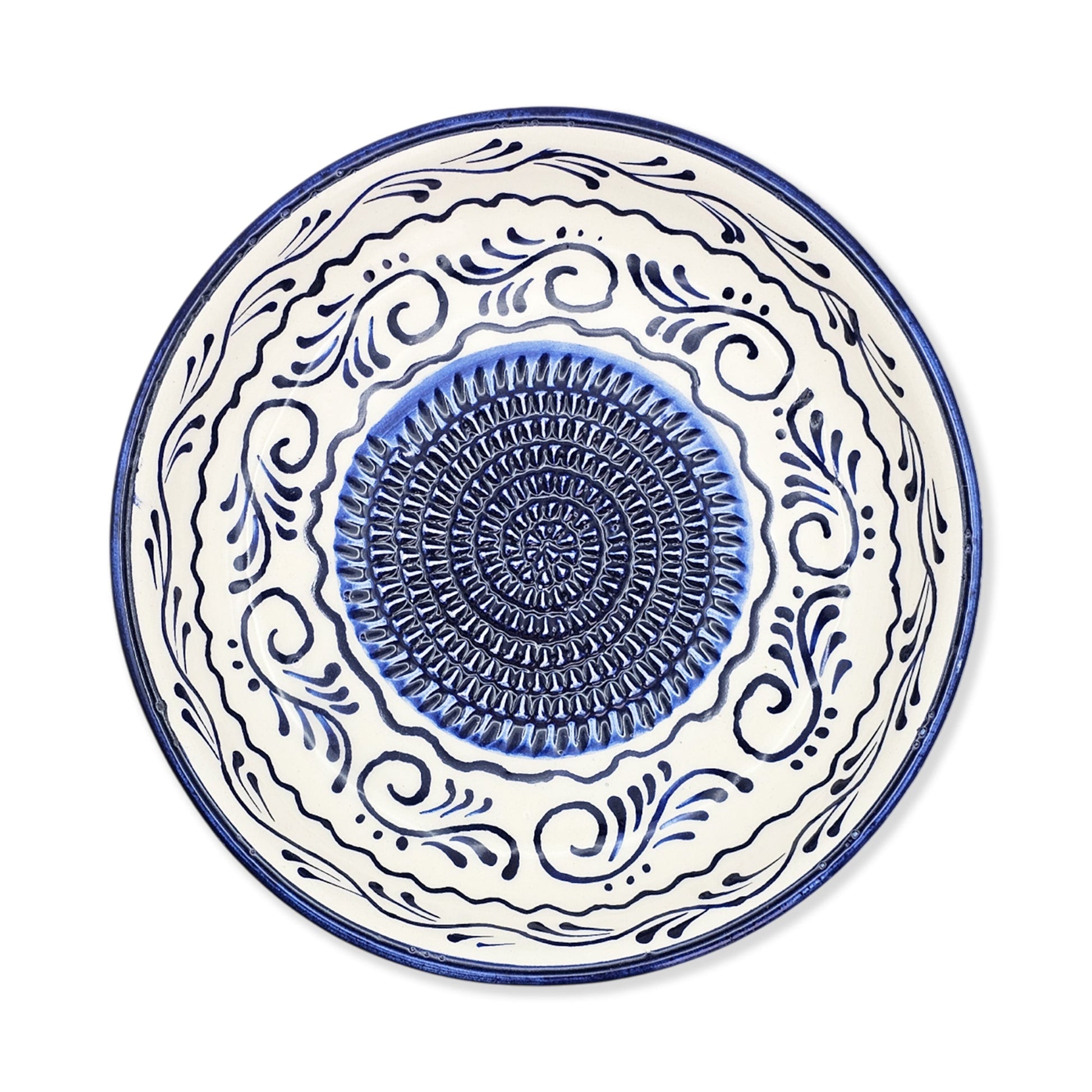 Ceramic garlic grater bowl with blue and white decorative patterns on a white background
