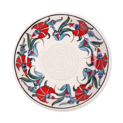 Ceramic garlic grater bowl with floral design on a white background
