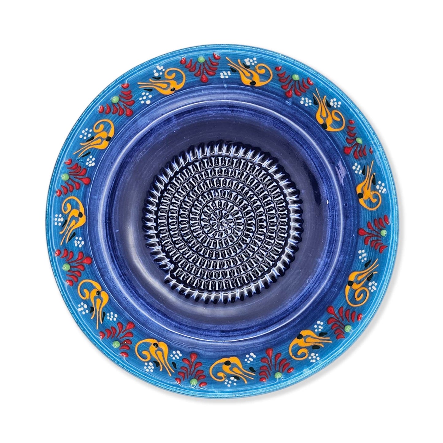 Decorative blue garlic grater bowl with colorful patterns on a white background
