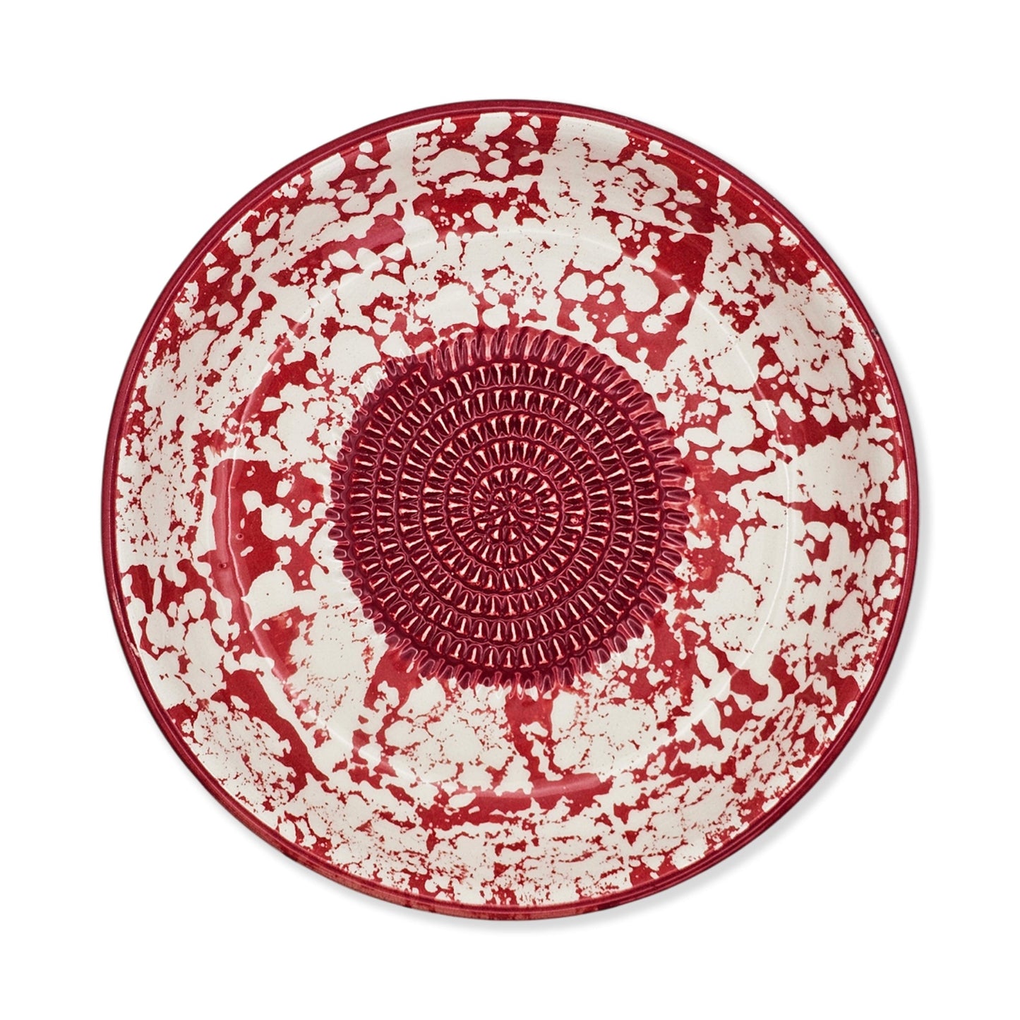 Red and white ceramic garlic grater bowl with textured center on a white background