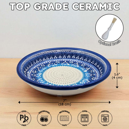 Top grade ceramic garlic grater bowl with blue and white design on a wooden surface, featuring dimensions and safety icons.