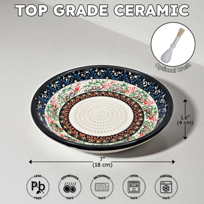 Decorative ceramic garlic grater bowl with floral patterns on a gray background, featuring dimensions and safety icons.