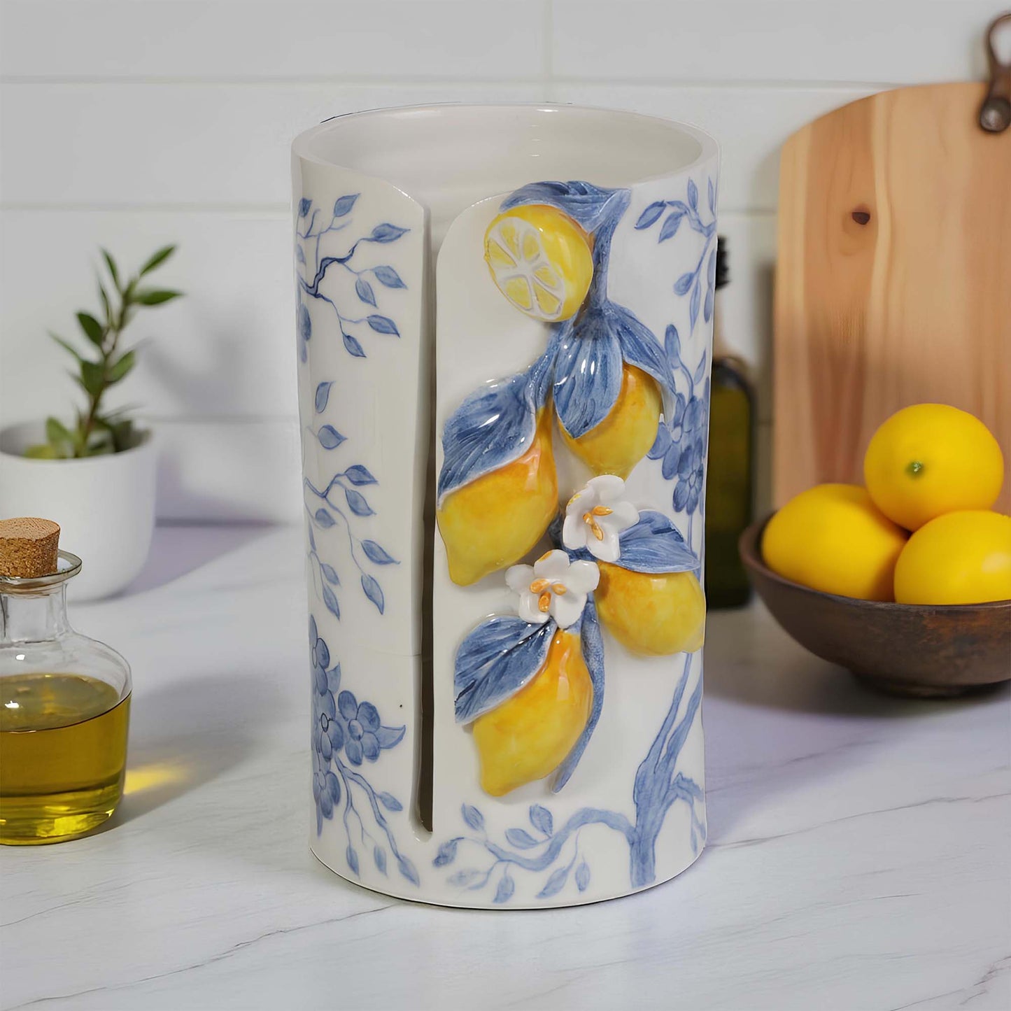 Ceramic paper towel holder with lemon design on a kitchen counter
