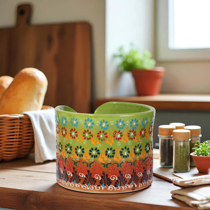 Decorative ceramic paper towel holder with floral pattern on a kitchen counter