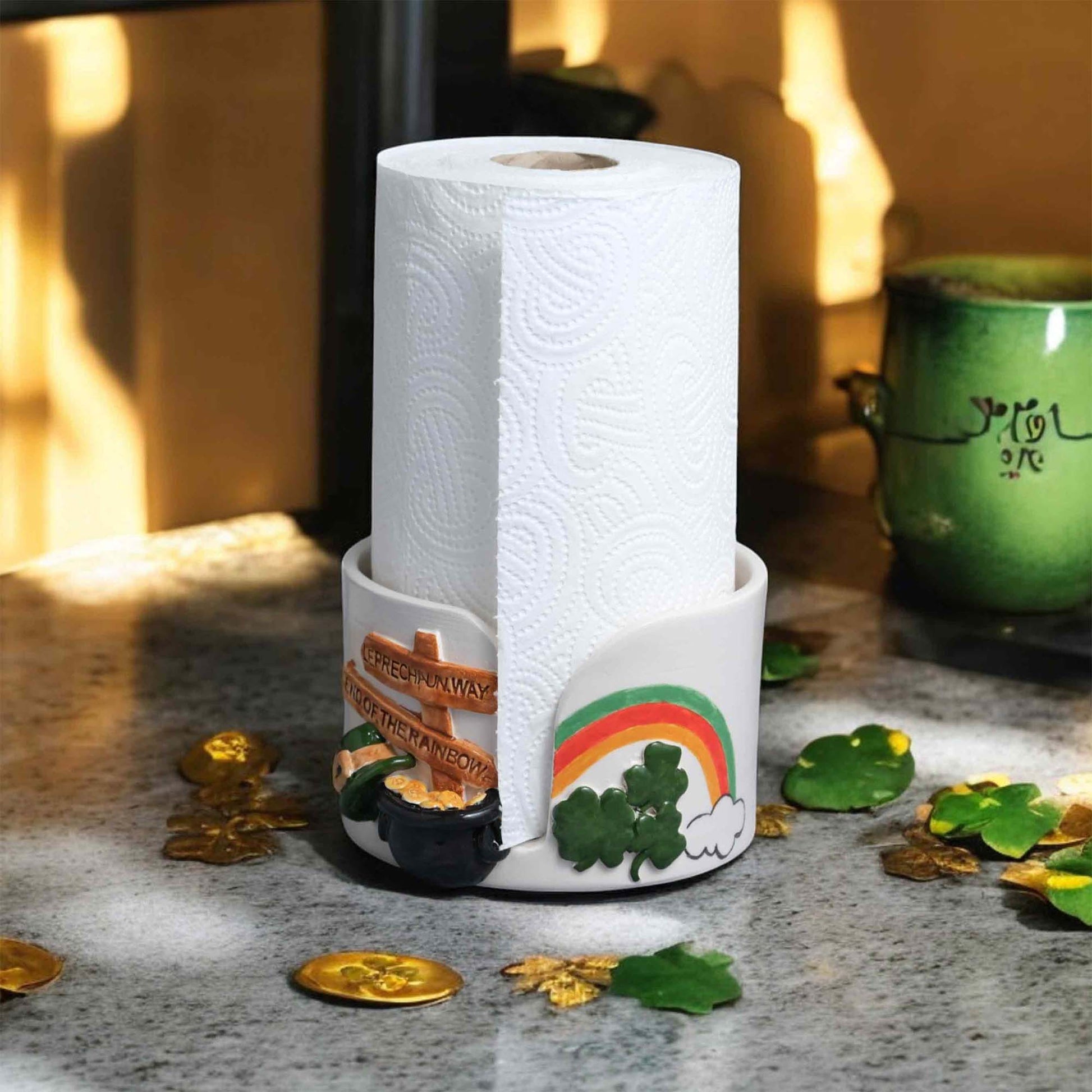 Decorative paper towel holder with a roll of paper towels on a kitchen counter.