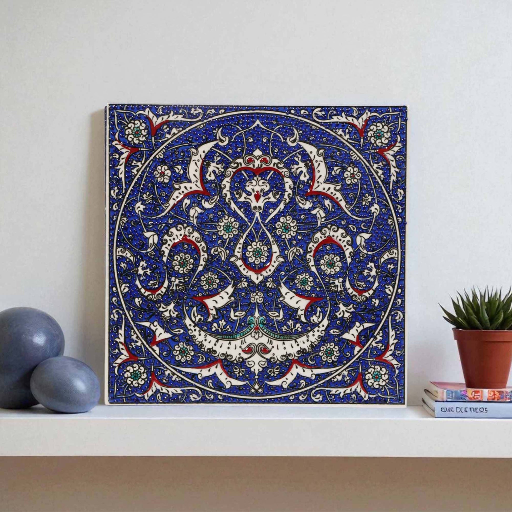 Decorative ceramic tile with intricate patterns on a white surface