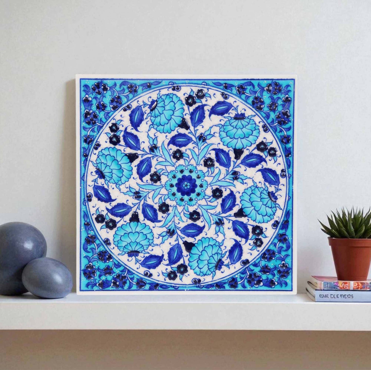 Ceramic tile with blue floral pattern on a white background