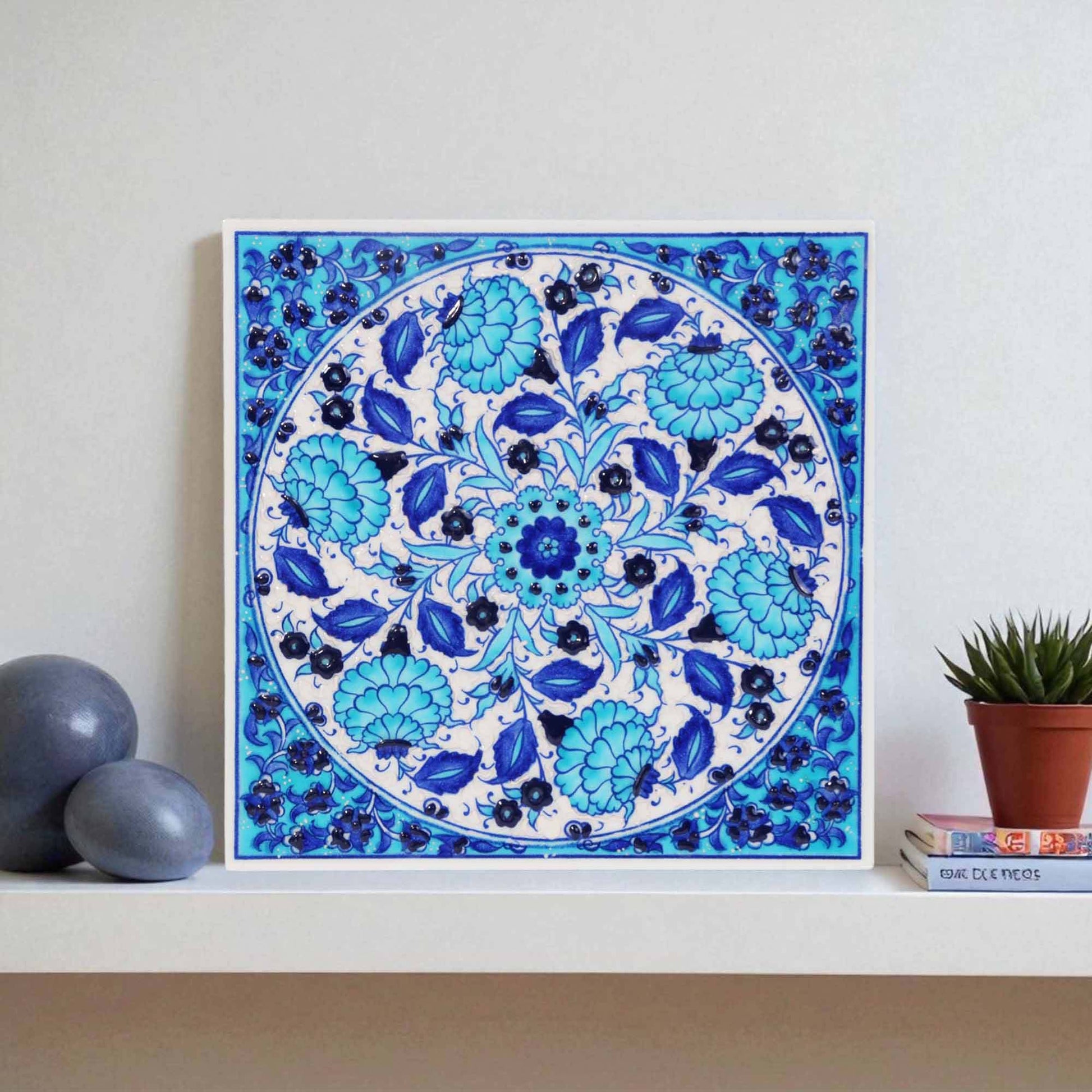 Ceramic tile with blue floral pattern on a white background