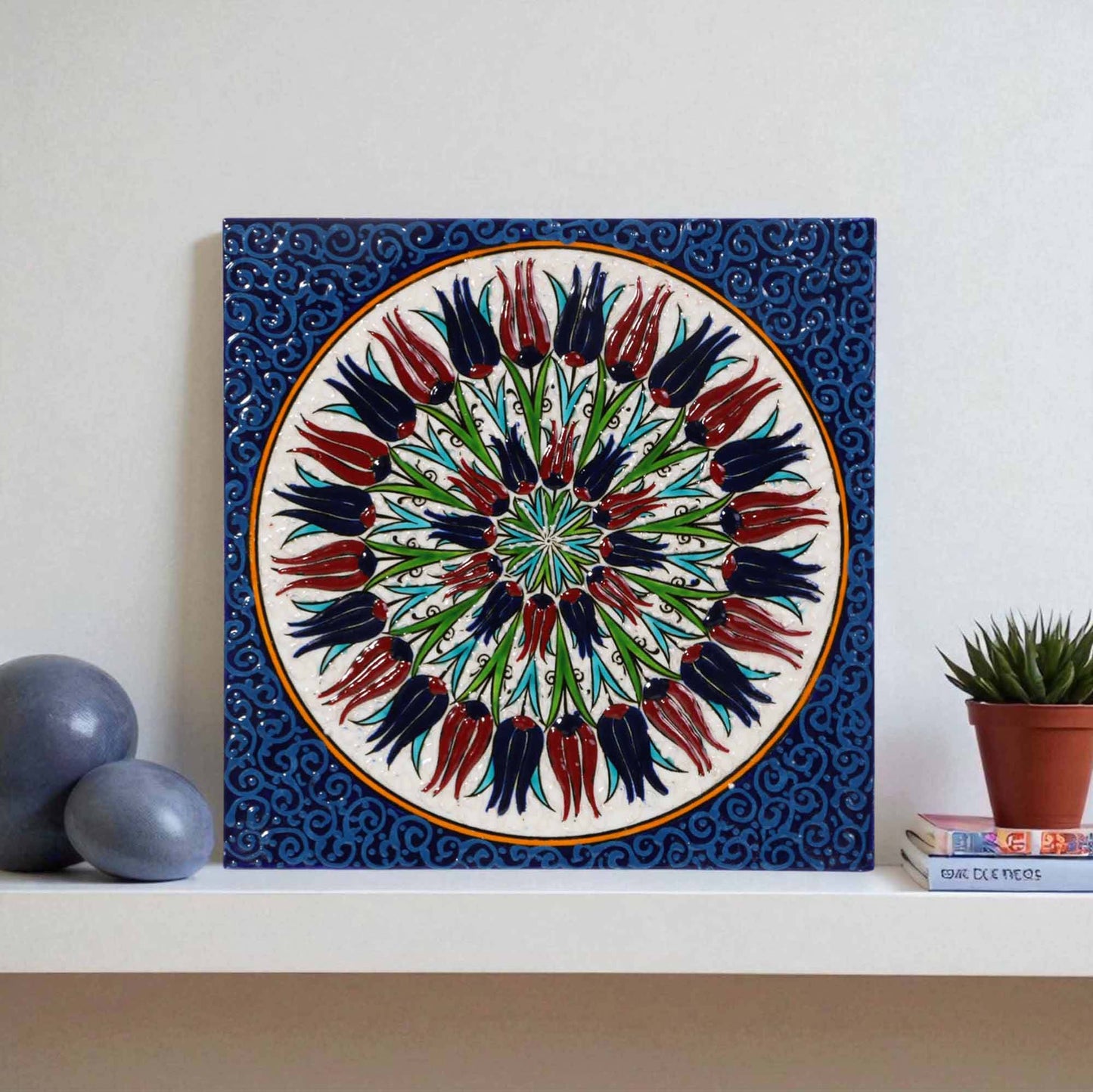 Decorative ceramic tile with floral design on a white wall