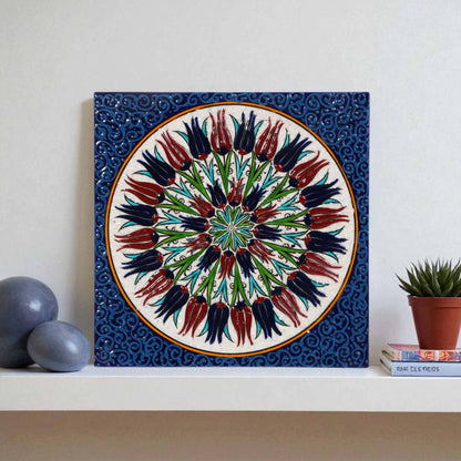 Decorative ceramic tile with floral design on a white wall