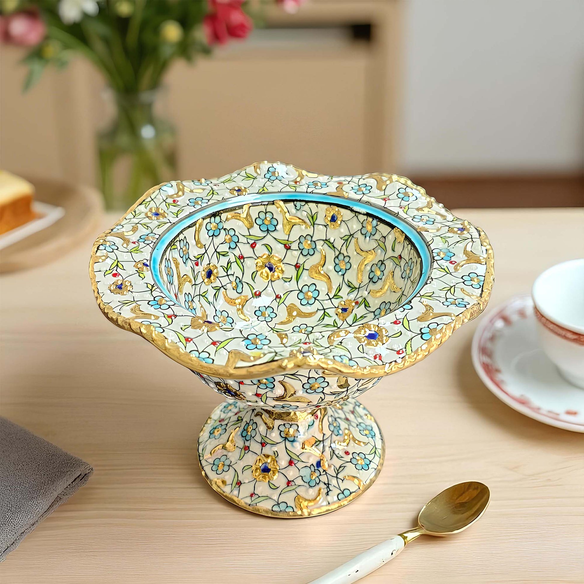 Decorative ceramic sugar bowl with floral patterns on a wooden table.