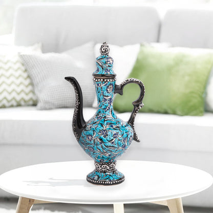 Hand-painted turquoise Ottoman-style ceramic ewer with floral motifs, curved spout & sculptural handle. Decorative artisan piece, perfect décor or gift.