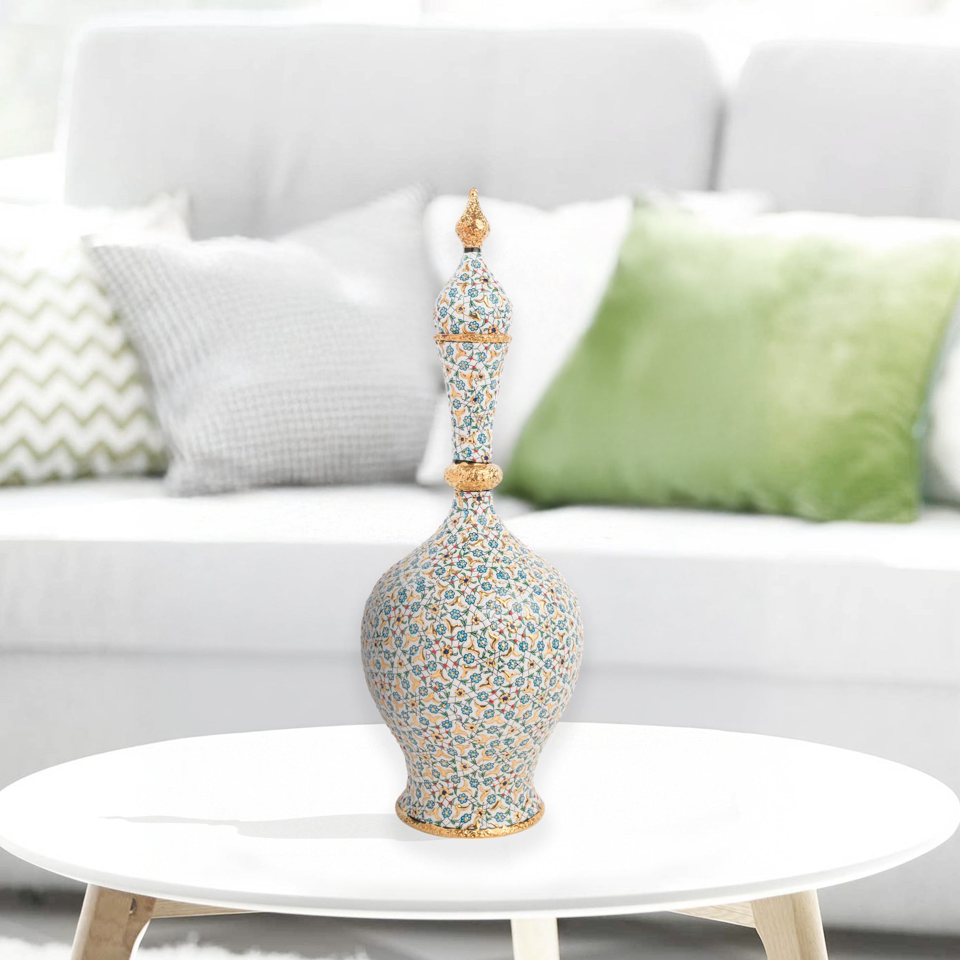 Hand-painted ceramic decorative bottle with turquoise floral motifs and golden details. Minaret-inspired shape with spire lid, perfect for décor or gifting.