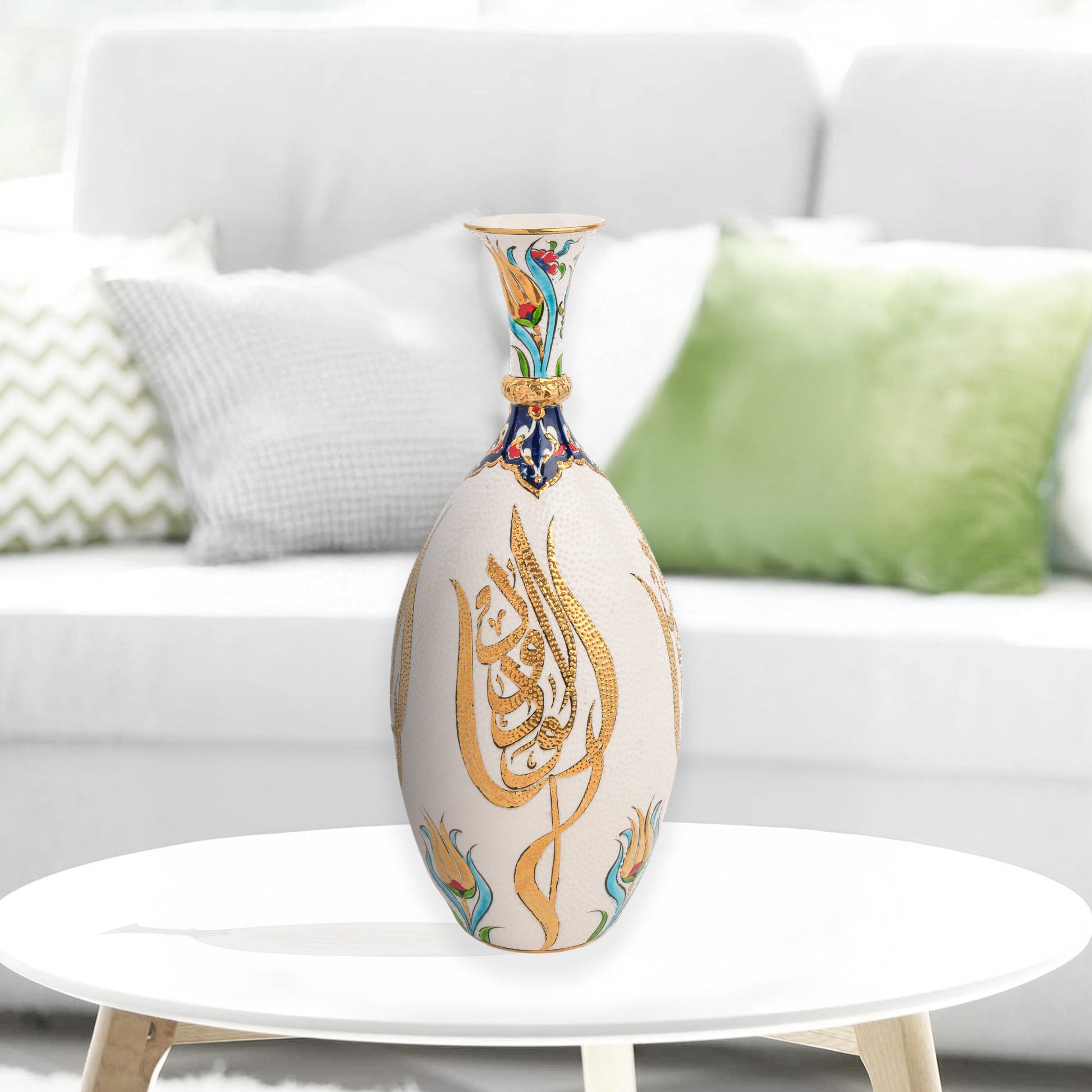 Hand-painted ceramic decorative bottle with golden Arabic calligraphy on ivory, accented with floral motifs. Glossy artisan vase, perfect for décor or gifts.