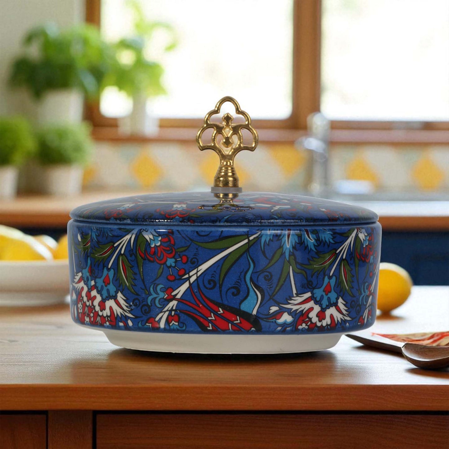 Decorative ceramic sugar bowl with floral patterns on a kitchen counter