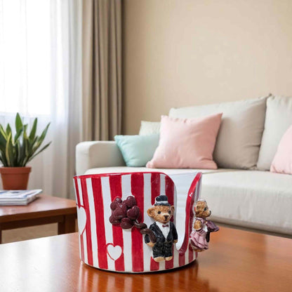 Decorative paper towel holder with teddy bears on a table in a living room setting
