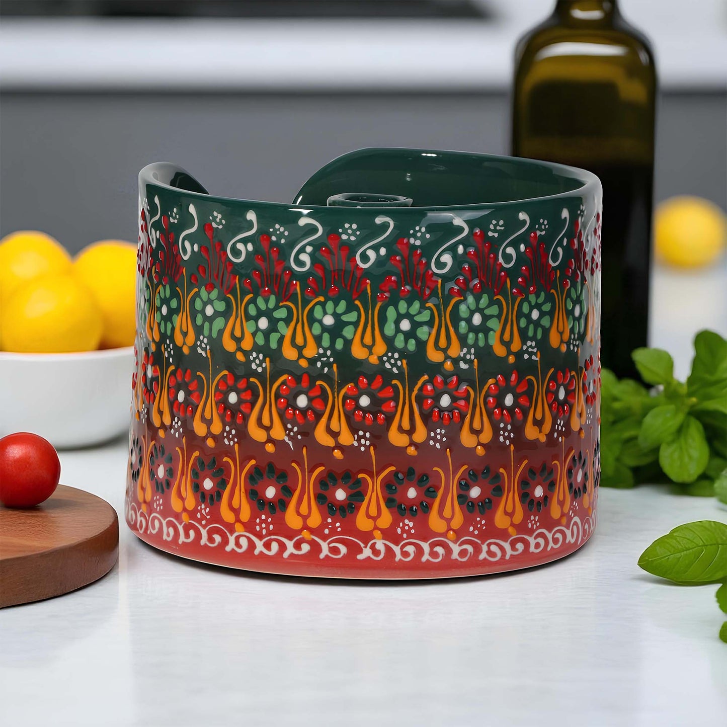 Decorative ceramic paper towel holder with colorful patterns on a kitchen counter.