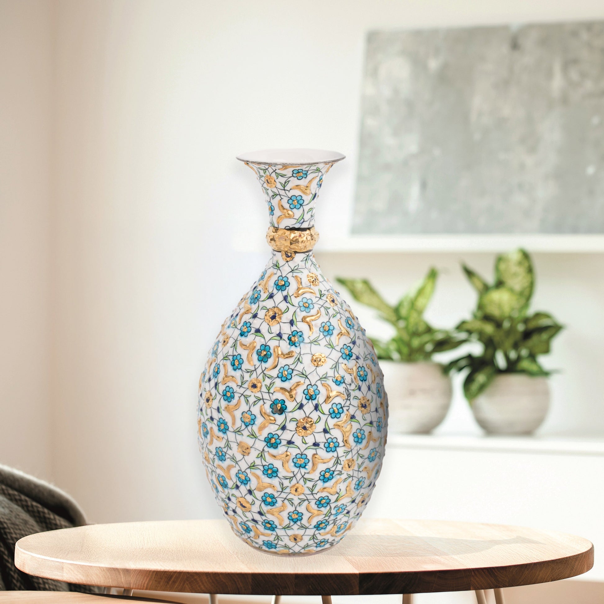 Hand-painted ceramic decorative bottle with turquoise and gold floral motifs on ivory. Glossy artisan vase, elegant décor accent, perfect for gifting.