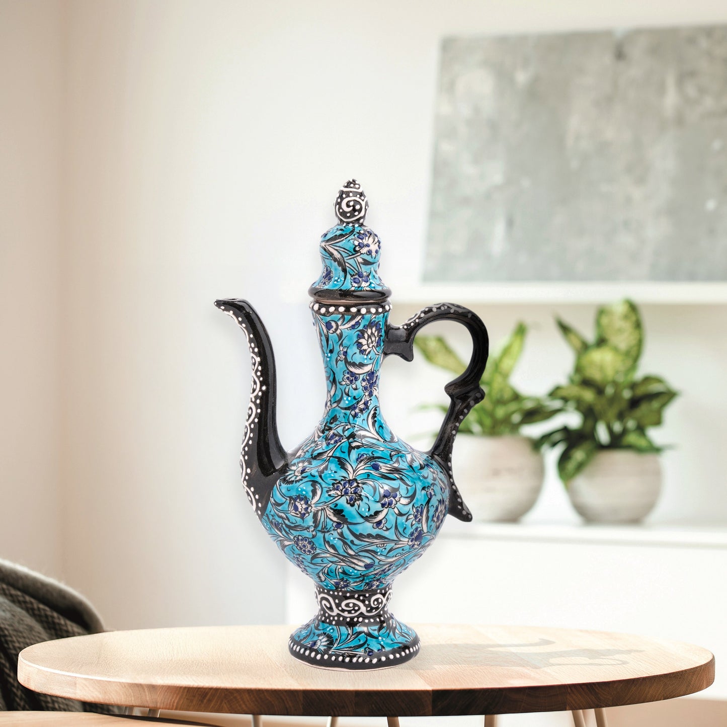 Hand-painted turquoise Ottoman-style ceramic ewer with floral motifs, curved spout & sculptural handle. Decorative artisan piece, perfect décor or gift.