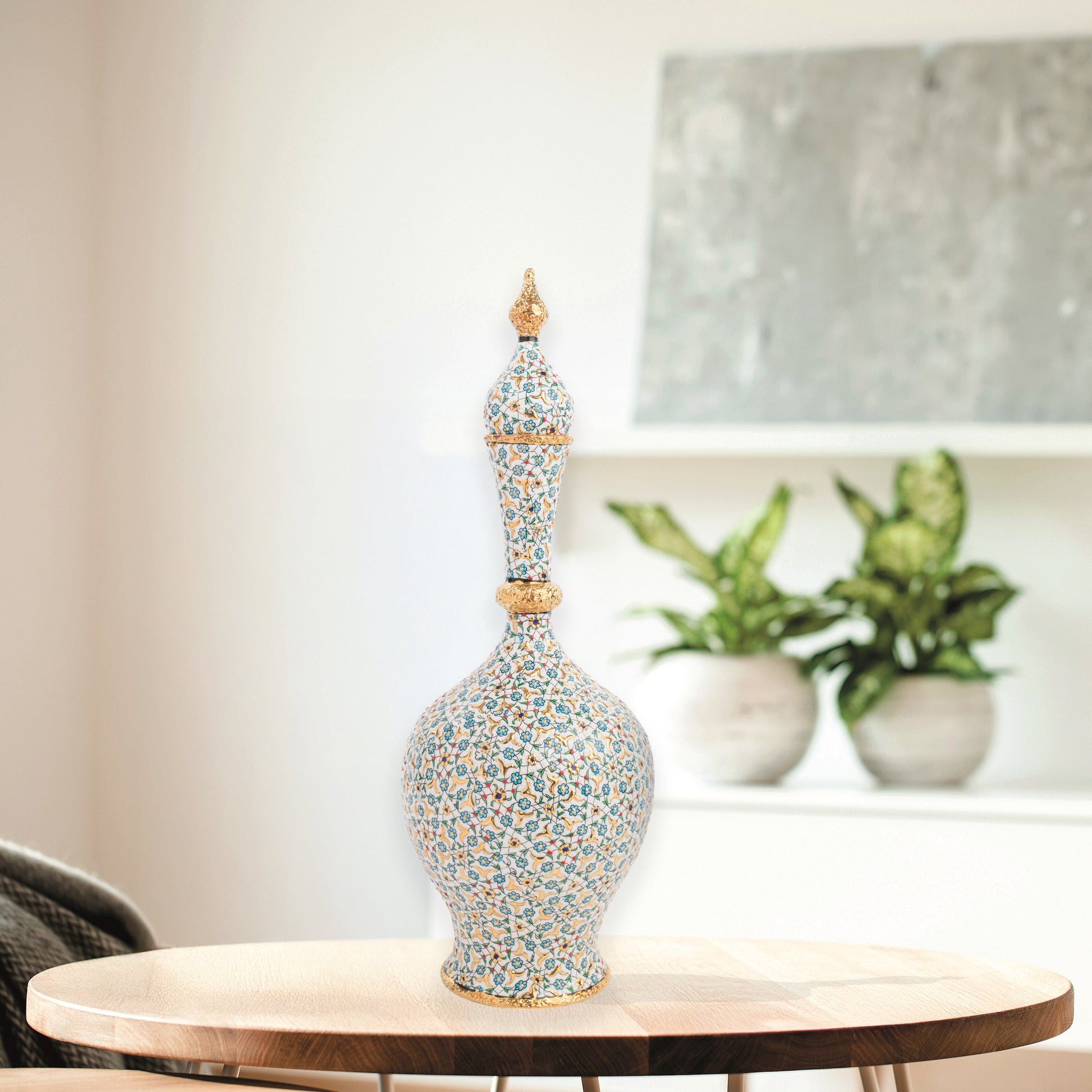 Hand-painted ceramic decorative bottle with turquoise floral motifs and golden details. Minaret-inspired shape with spire lid, perfect for décor or gifting.