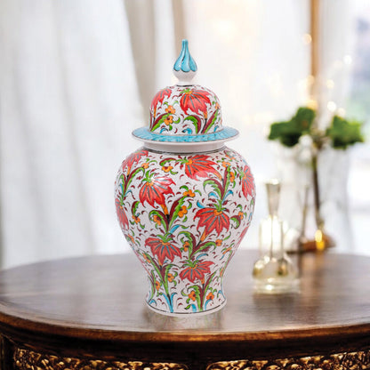 Hand-painted Tulip Garden ceramic jar with vivid red tulips, yellow blossoms & green foliage. Lidded artisan jar with turquoise finial, perfect décor or gift.