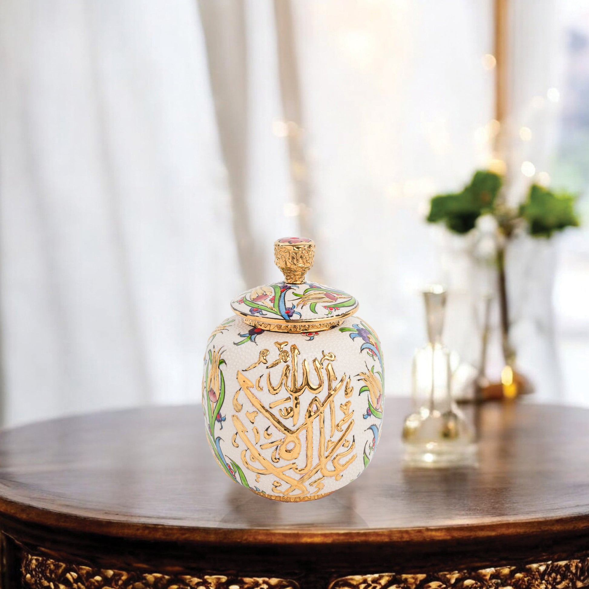 Hand-painted Divine Script ceramic jar with golden Arabic calligraphy and floral motifs. Lidded artisan jar, perfect for honey, ginger, spices, or spiritual décor.