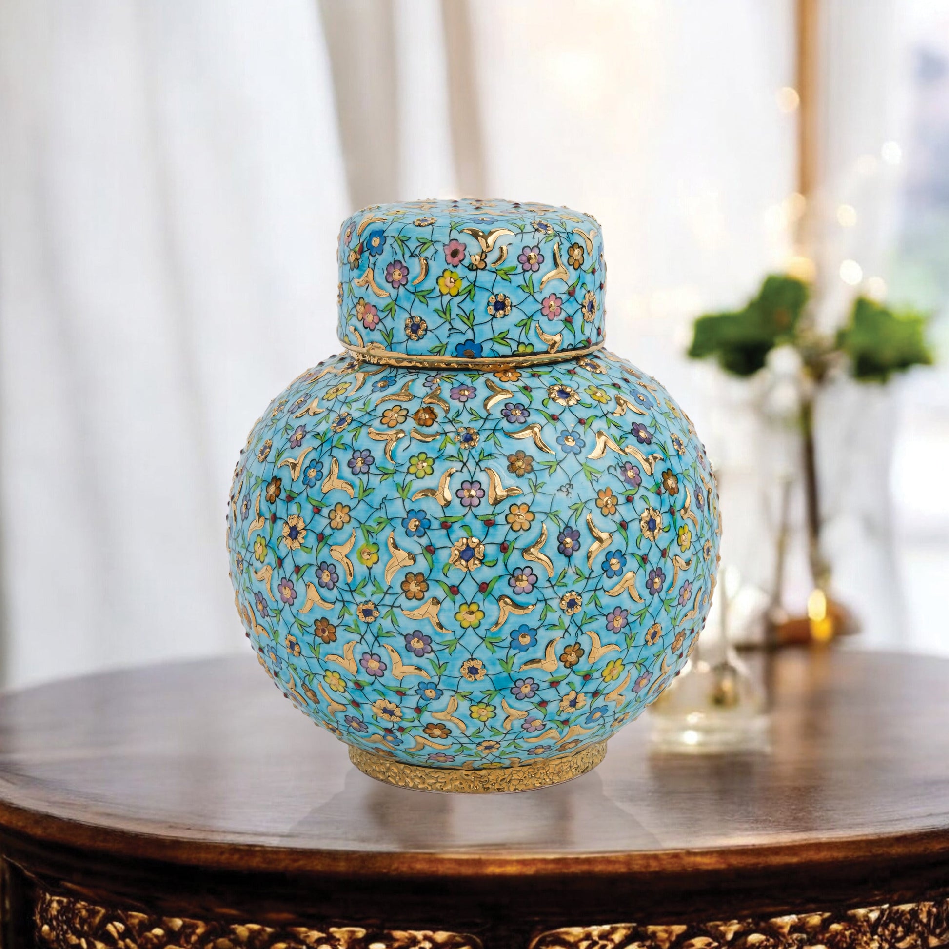Hand-painted Turquoise Blossom ceramic jar with lid. Features floral motifs in turquoise, lavender & gold. Round melon shape, artisan-made, perfect décor.