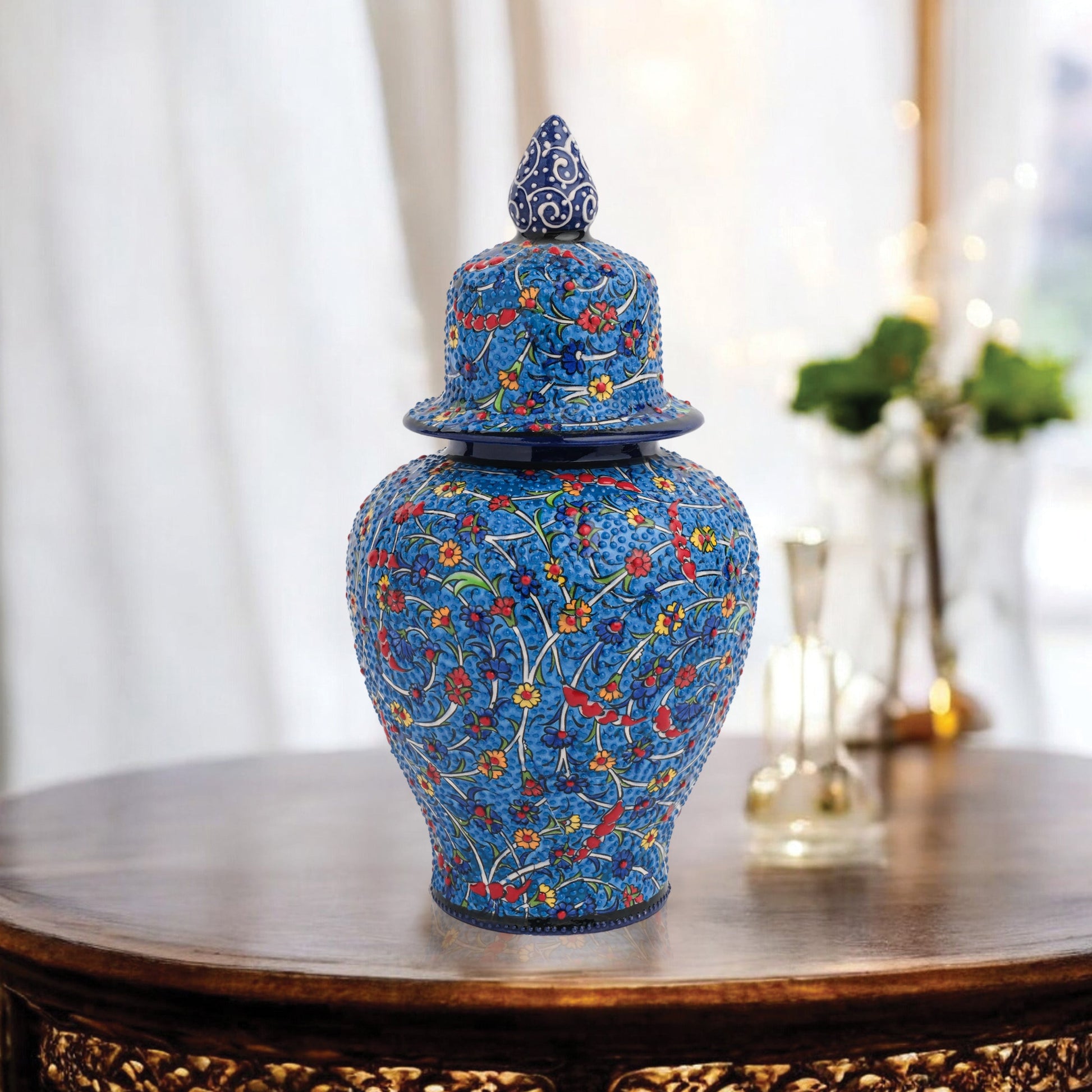 Hand-painted Blossom Night ceramic jar with vivid yellow, red & blue florals on cobalt base. Glossy artisan jar with ornate finial, perfect décor or gift.