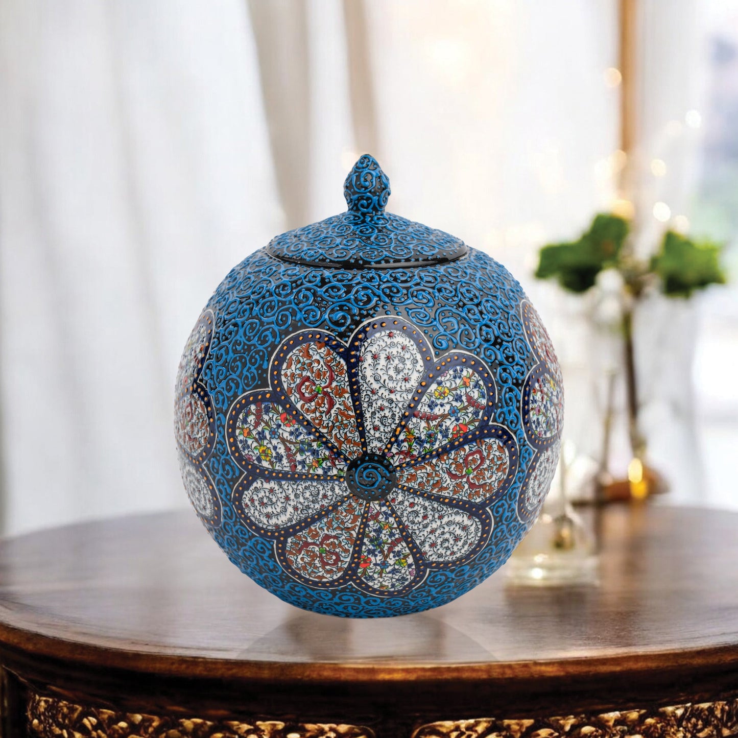 Hand-painted Blue Blossom globe jar with layered floral motifs and raised blue scrollwork. Spherical ceramic jar, artisan-made, perfect décor or gift.