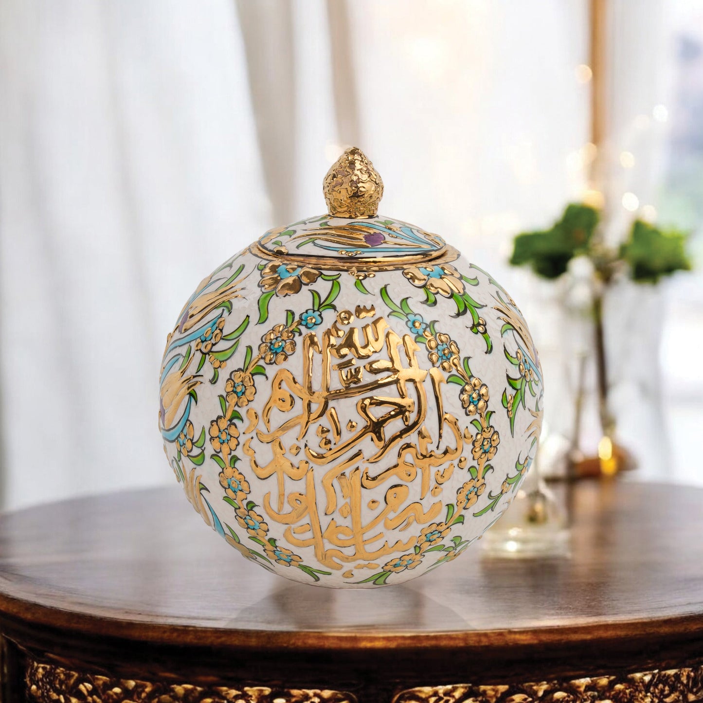 Hand-painted Floral Script globe jar with golden Arabic calligraphy and turquoise floral motifs. Spherical ceramic design, artisan-made, perfect décor or gift.