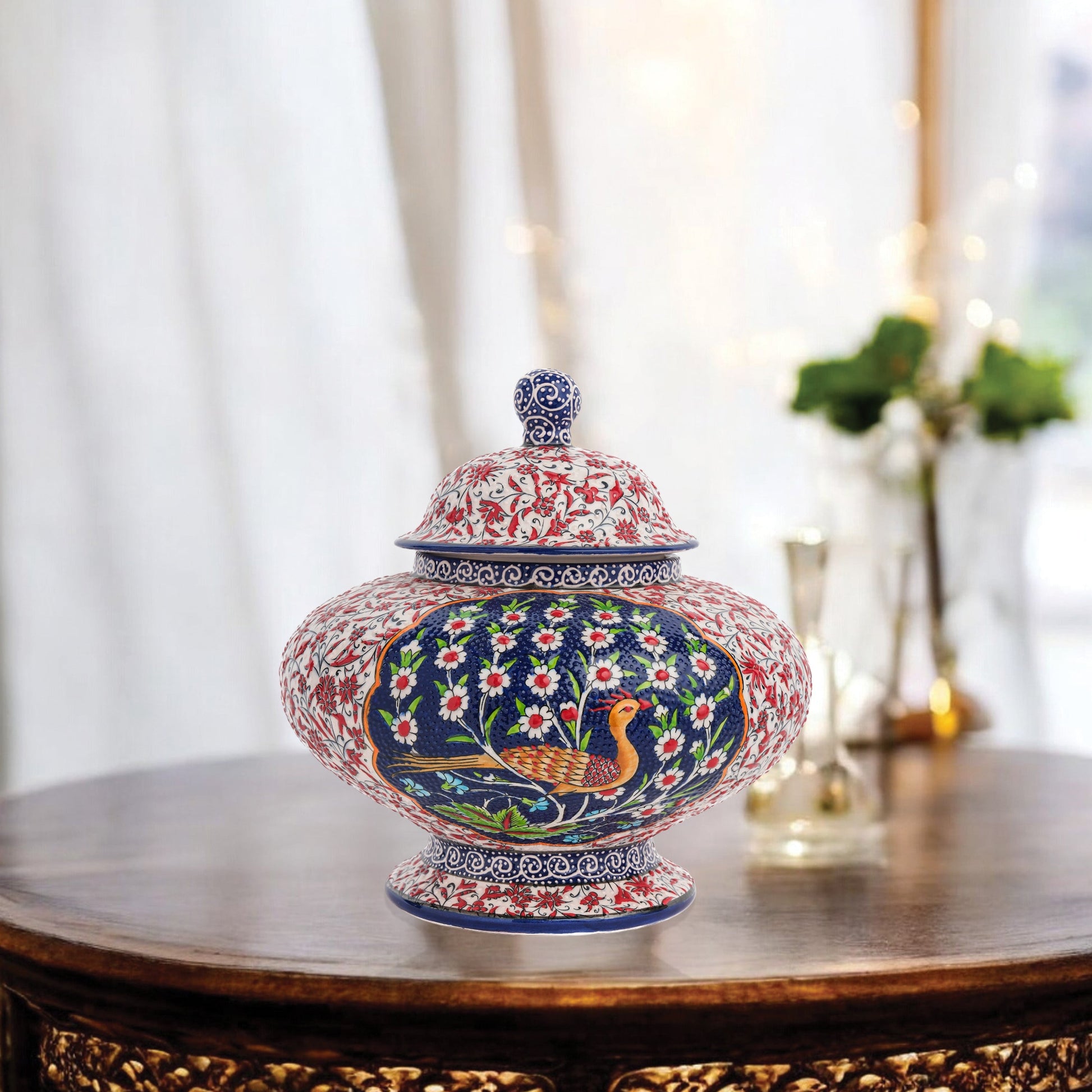 Hand-painted Songbird Bloom ceramic jar with bird and daisy motifs in navy, red & green. Wide artisan jar, glossy glazed, perfect décor accent or gift.