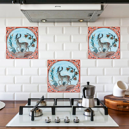 Decorative ceramic tiles with deer design on a kitchen backsplash.