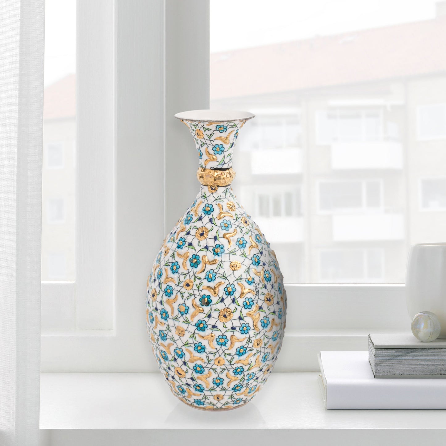Hand-painted ceramic decorative bottle with turquoise and gold floral motifs on ivory. Glossy artisan vase, elegant décor accent, perfect for gifting.