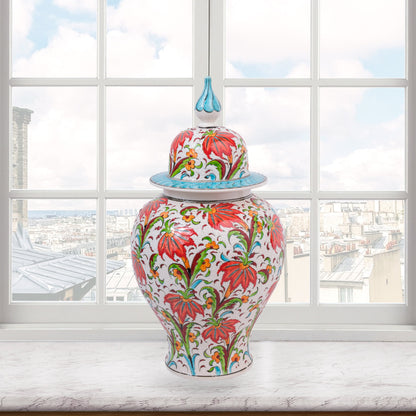 Hand-painted Tulip Garden ceramic jar with vivid red tulips, yellow blossoms & green foliage. Lidded artisan jar with turquoise finial, perfect décor or gift.
