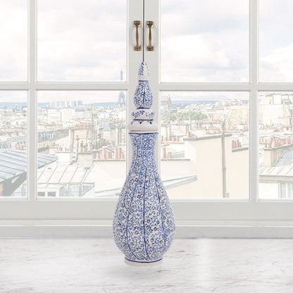 Hand-painted Iznik Nightingale’s Eye ceramic vase with lid, featuring blue vine motifs on white. Tall Ottoman-inspired design, perfect for décor or gifting.