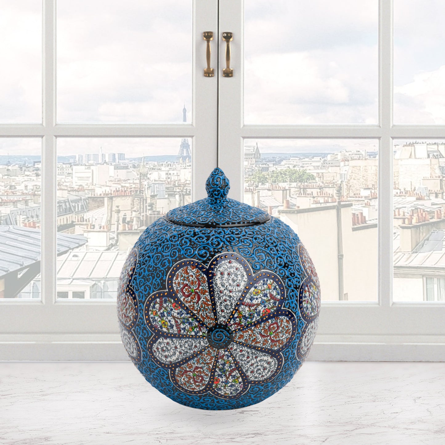 Hand-painted Blue Blossom globe jar with layered floral motifs and raised blue scrollwork. Spherical ceramic jar, artisan-made, perfect décor or gift.