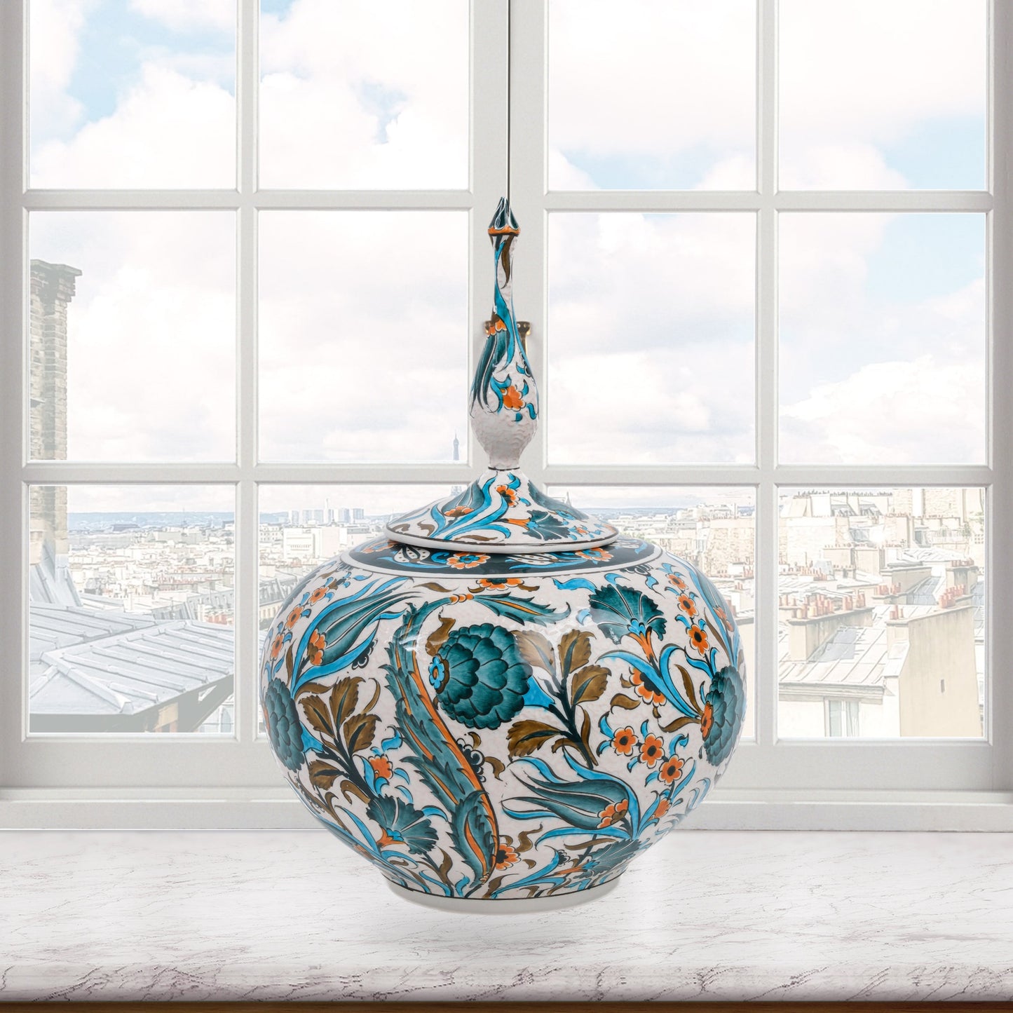 Hand-painted Iznik Bloom globe jar with teal blooms, tulips & vines on white. Bulbous Ottoman-inspired ceramic jar with finial lid, perfect décor or gift.