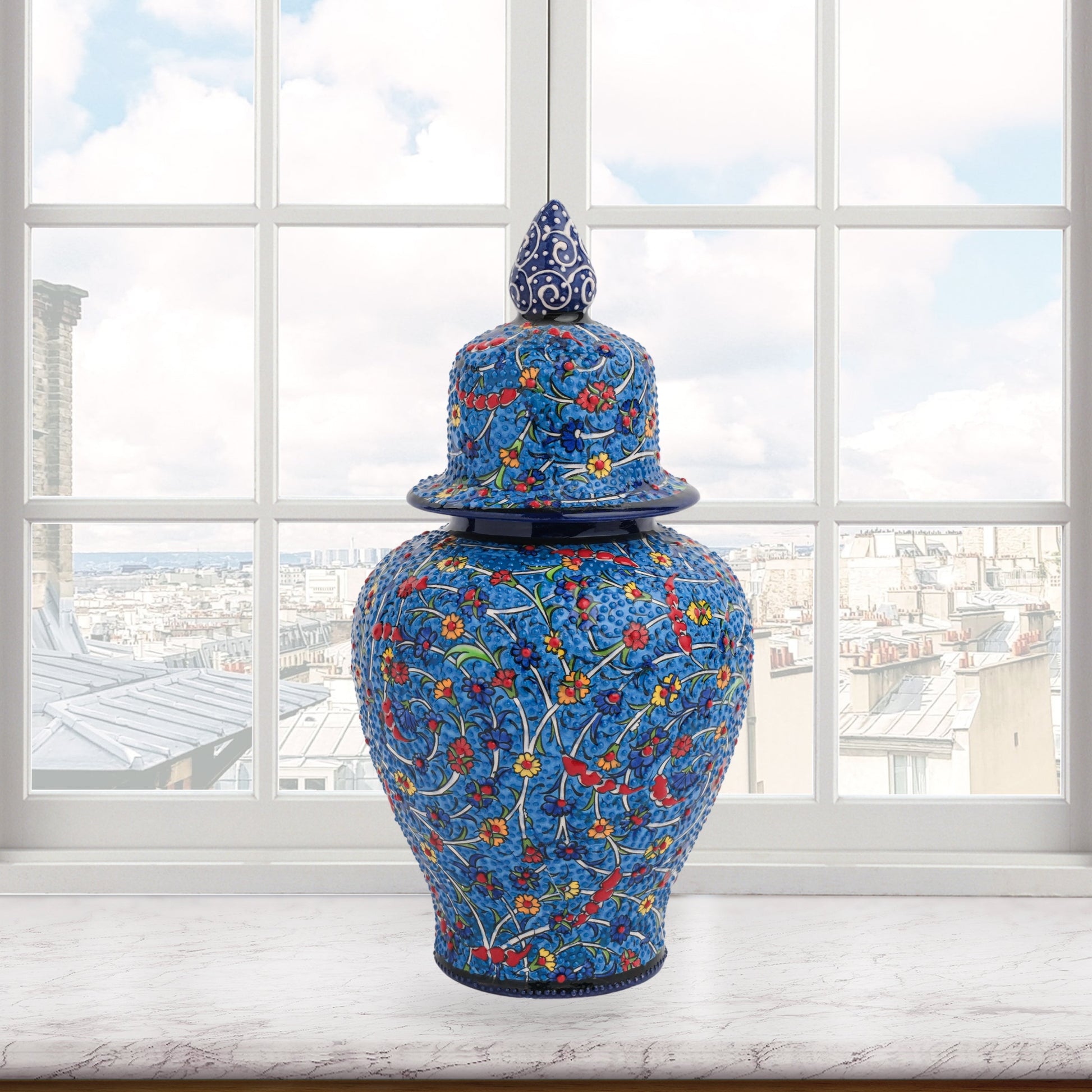 Hand-painted Blossom Night ceramic jar with vivid yellow, red & blue florals on cobalt base. Glossy artisan jar with ornate finial, perfect décor or gift.