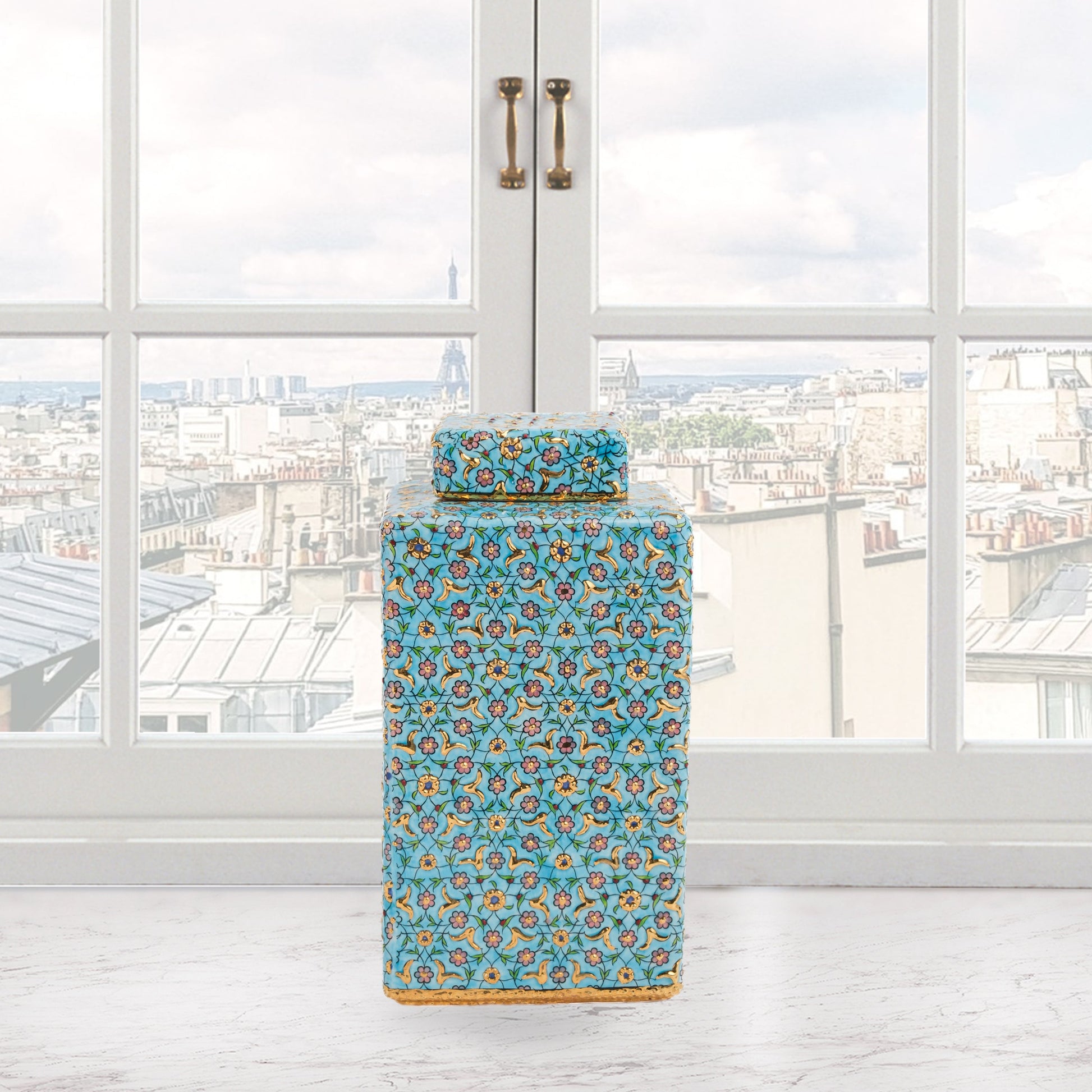 Hand-painted Golden Blossom ceramic jar with turquoise base and gold floral motifs. Square lidded design, artisan-made, perfect for décor, tea, or gifts.