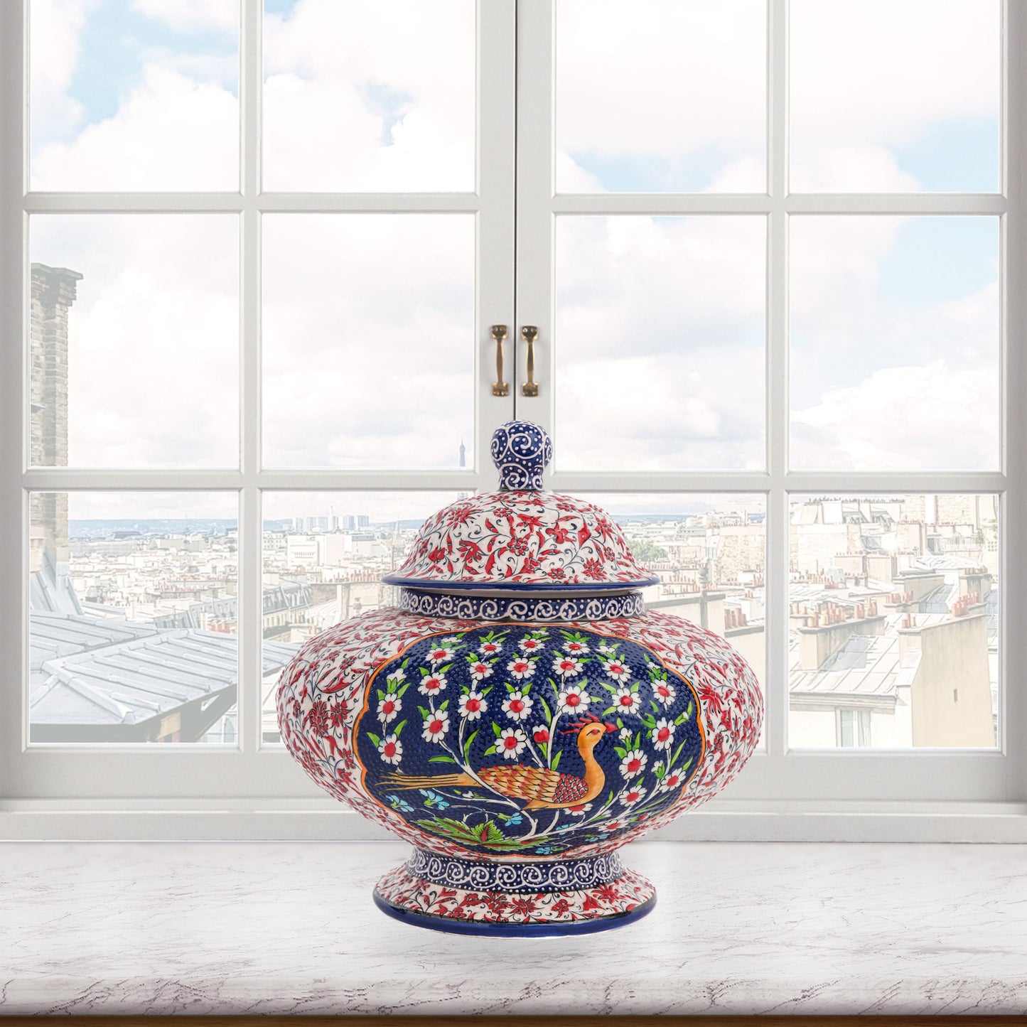 Hand-painted Songbird Bloom ceramic jar with bird and daisy motifs in navy, red & green. Wide artisan jar, glossy glazed, perfect décor accent or gift.