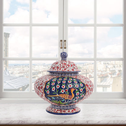 Hand-painted Songbird Bloom ceramic jar with bird and daisy motifs in navy, red & green. Wide artisan jar, glossy glazed, perfect décor accent or gift.