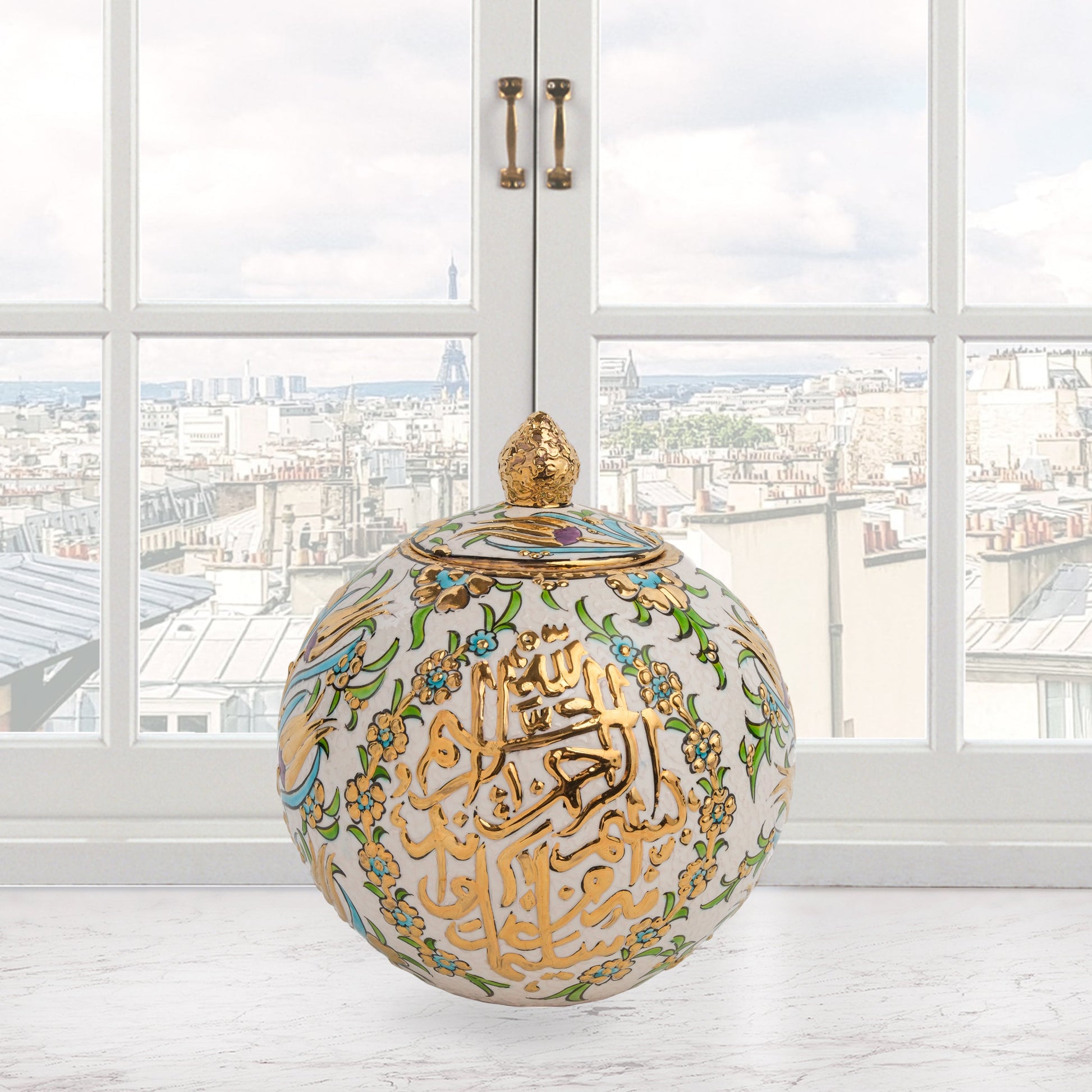 Hand-painted Floral Script globe jar with golden Arabic calligraphy and turquoise floral motifs. Spherical ceramic design, artisan-made, perfect décor or gift.