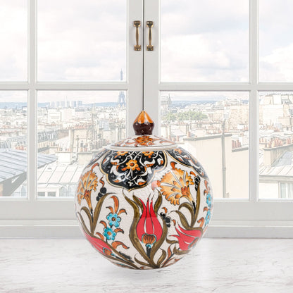 Hand-painted Red Tulip globe jar with Ottoman floral motifs in red, blue & gold. Glossy round ceramic jar, artisan-crafted, perfect décor or thoughtful gift.