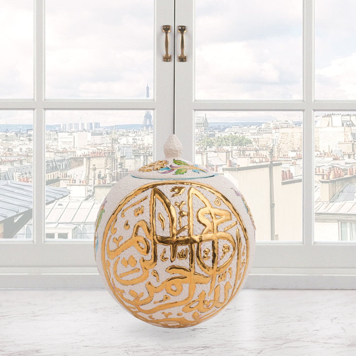 Hand-painted Gold Script globe jar with Arabic calligraphy and turquoise floral motifs. Spherical ceramic design with gold finial, perfect décor or gift.