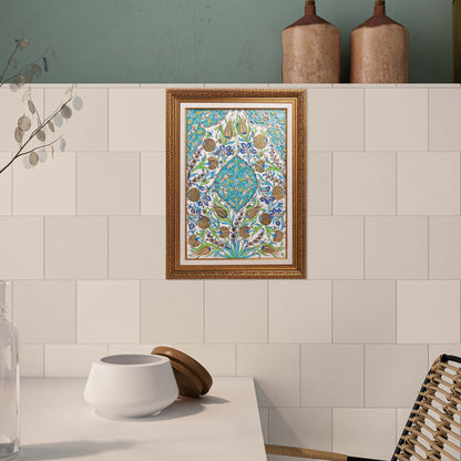 Decorative ceramic tile on a tiled wall with a wooden frame.