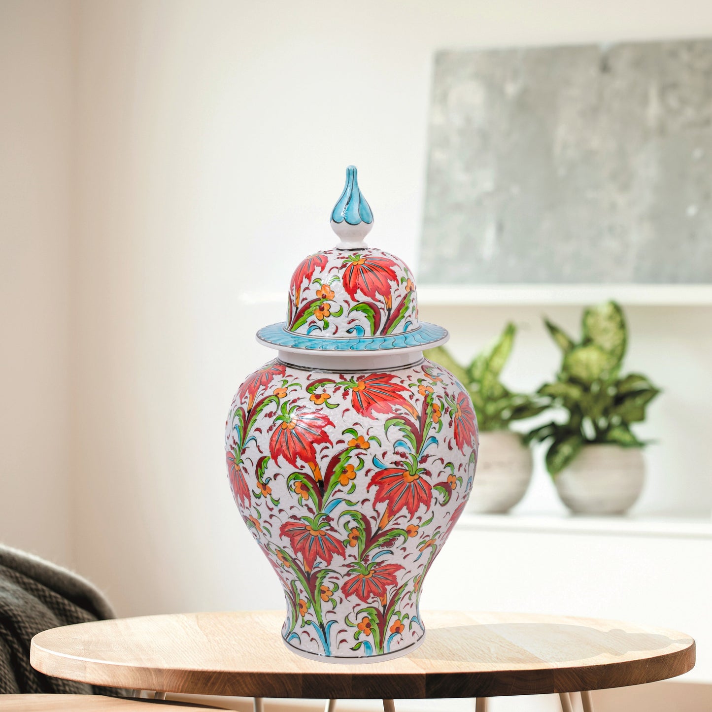 Hand-painted Tulip Garden ceramic jar with vivid red tulips, yellow blossoms & green foliage. Lidded artisan jar with turquoise finial, perfect décor or gift.