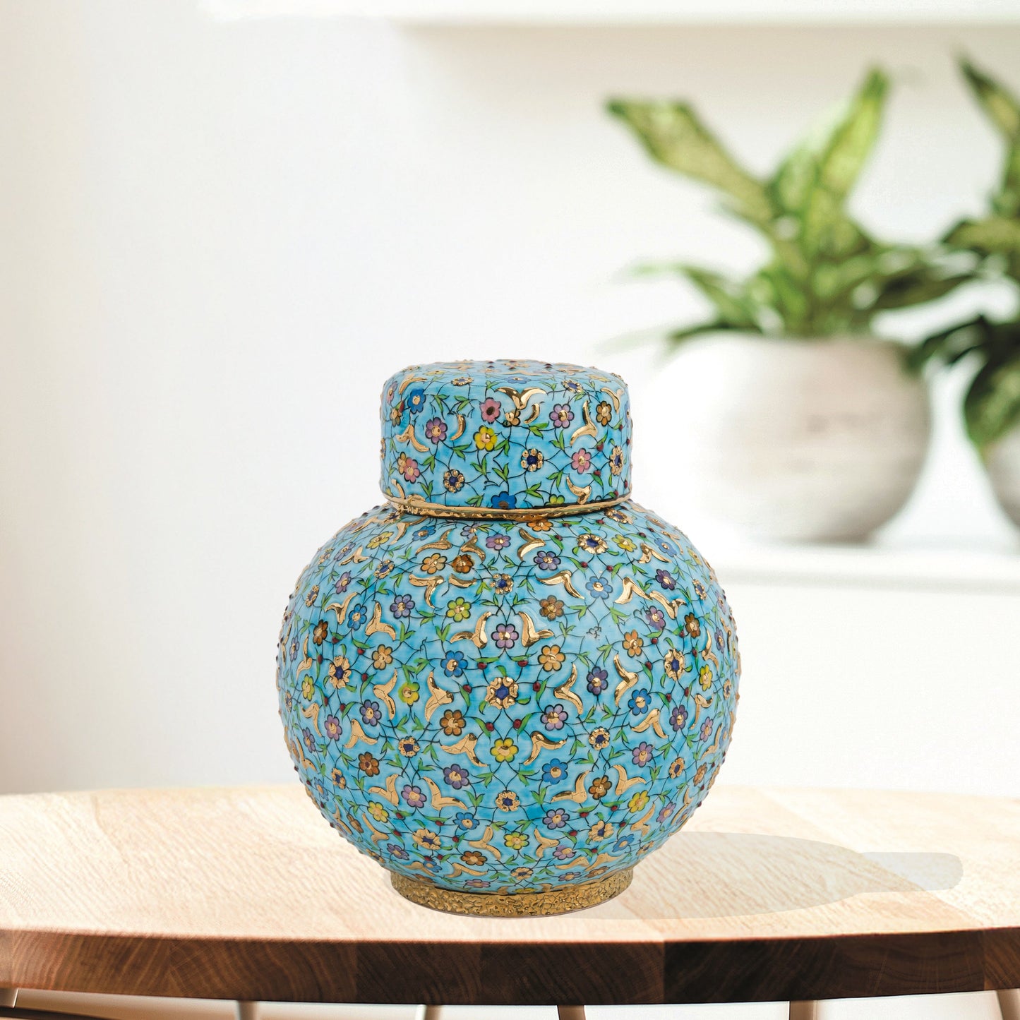 Hand-painted Turquoise Blossom ceramic jar with lid. Features floral motifs in turquoise, lavender & gold. Round melon shape, artisan-made, perfect décor.