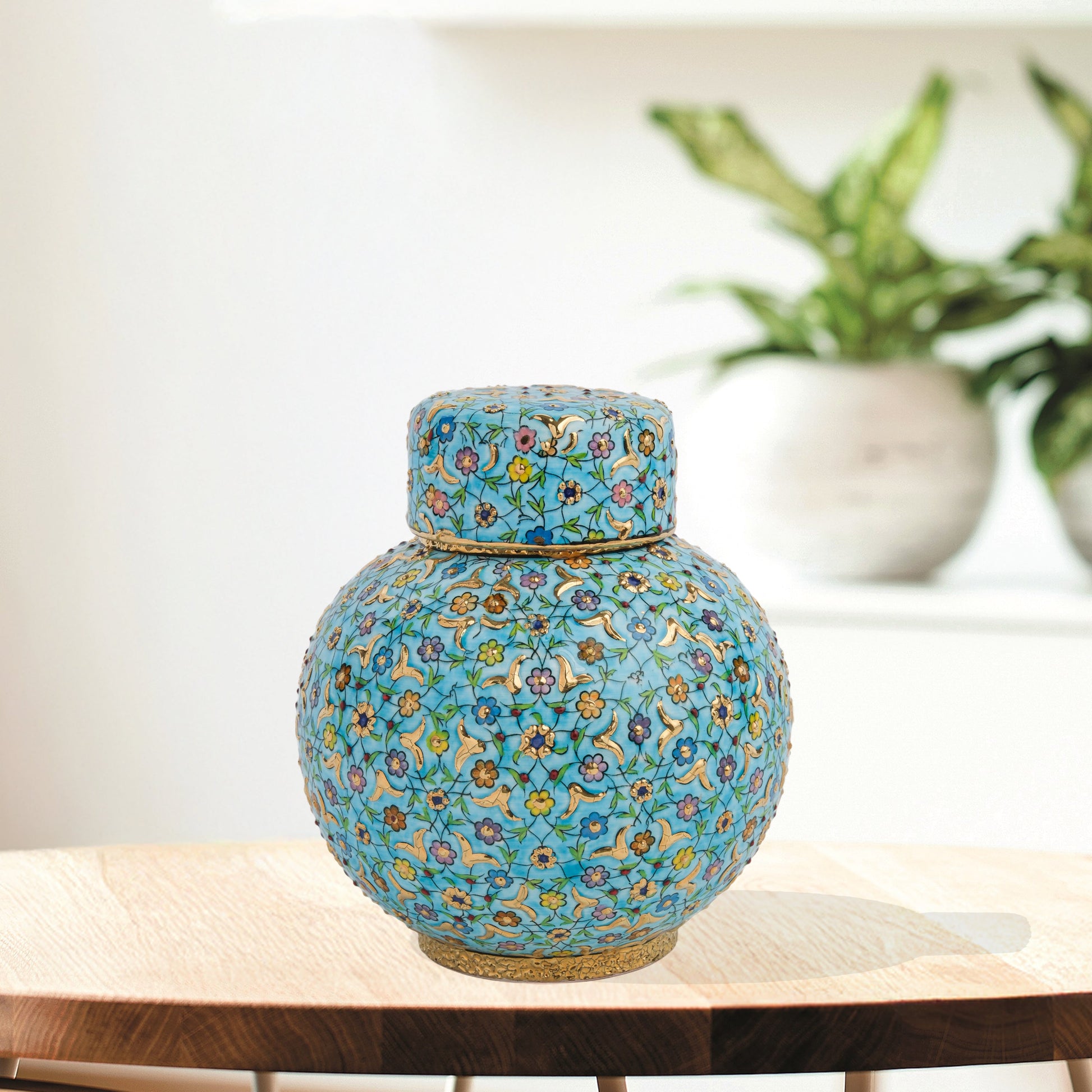 Hand-painted Turquoise Blossom ceramic jar with lid. Features floral motifs in turquoise, lavender & gold. Round melon shape, artisan-made, perfect décor.