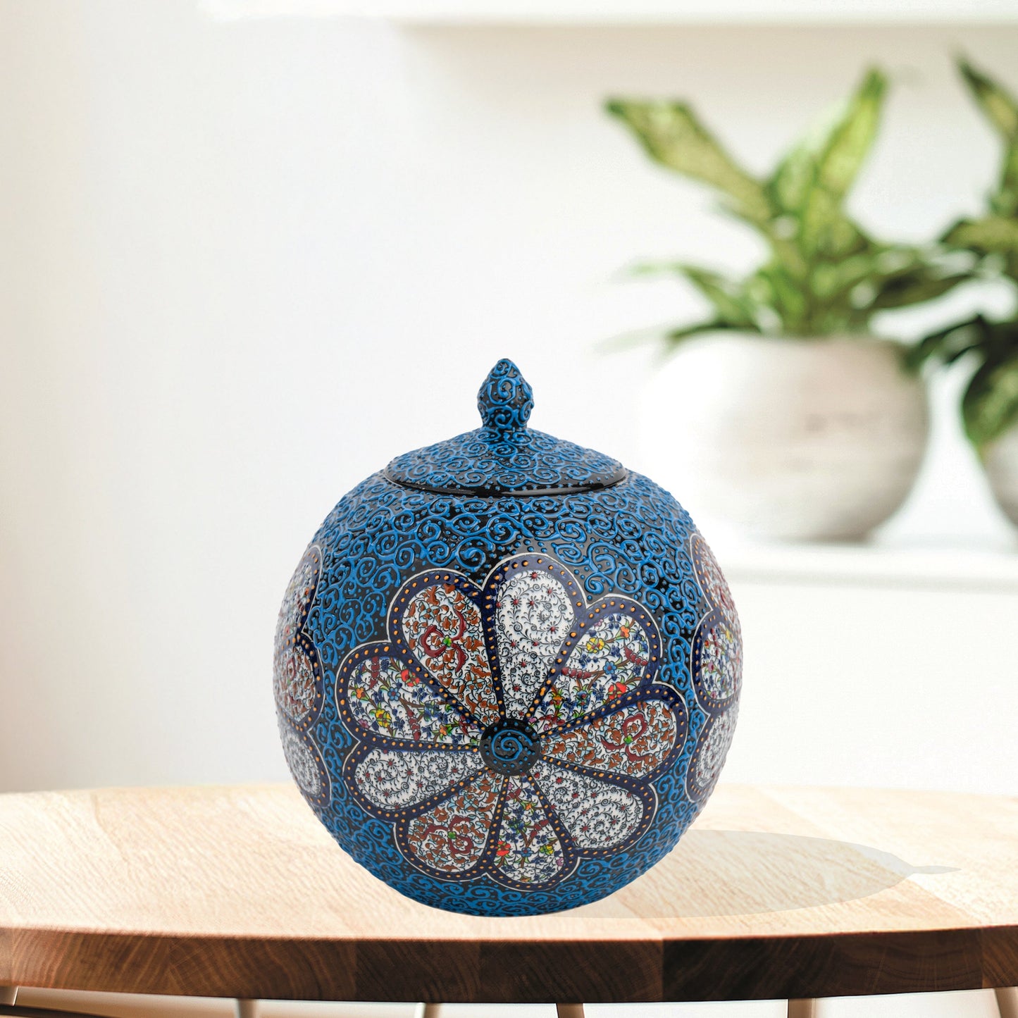 Hand-painted Blue Blossom globe jar with layered floral motifs and raised blue scrollwork. Spherical ceramic jar, artisan-made, perfect décor or gift.